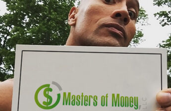 The Rock Holding a Masters of Money LLC Logo Sign