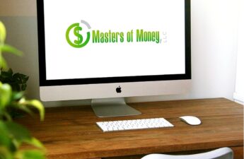 Desktop Computer with Masters of Money LLC Logo Screensaver Photo