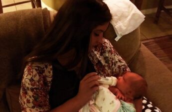 Malia Johnson Holding Baby Daughter Photo