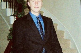 Michael MJ The Terrible Johnson Wearing a Suit on the stairs at his Home In Austin Texas Photo