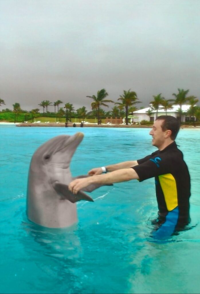 Michael "MJ The Terrible" Johnson Swimming With The Dolphins In The Bahamas at Atlantis Resort Photo #2